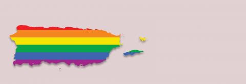 A rainbow flag in the shape of Puerto Rico