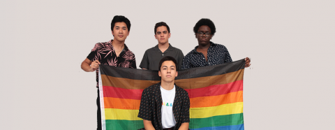 GLSEN Students Holding Rainbow Flag with Black and Brown stripe